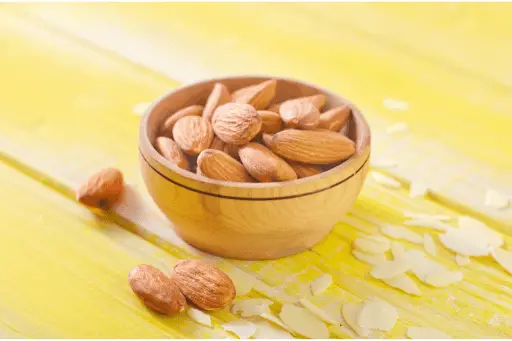 Almonds in wooden bowl for weight loss