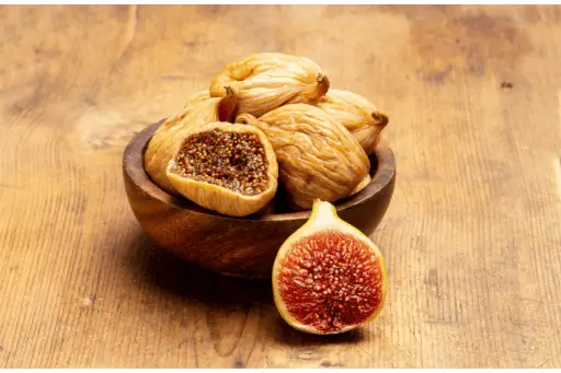 Dry figs in wooden bowl