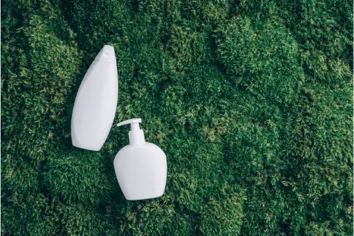Shampoo bottles on grass