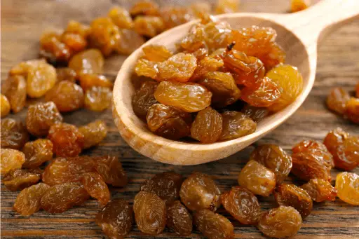 Raisins in a Wooden Spoon