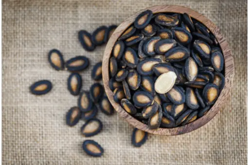 Watermelon seeds in wooden bowl