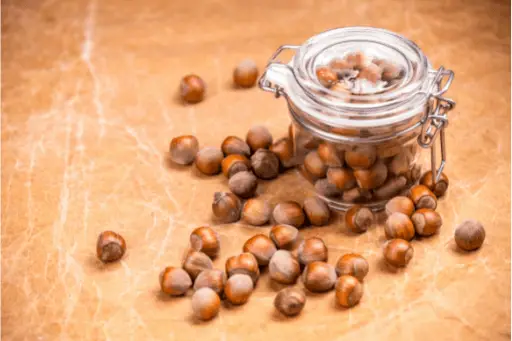 Hazelnuts in glass jar