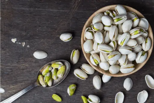 Pistachios in wooden bowl