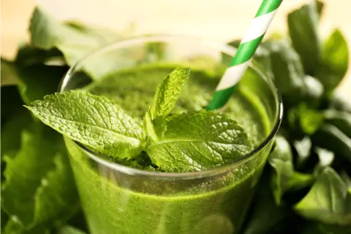 Mint juice with mint leaves in glass