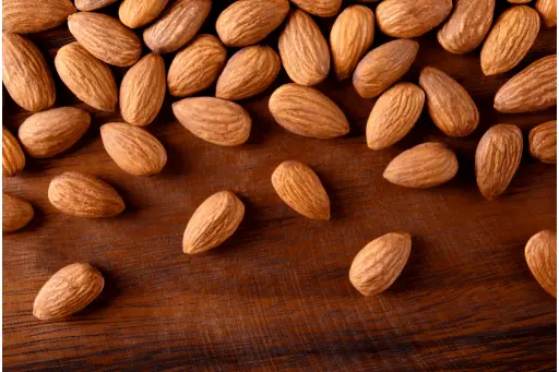 Almonds on wooden table